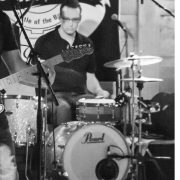 Kevin black and white playing drums